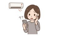 故障したエアコンを早く直したいものの、修理業者選びに不安を感じる女性